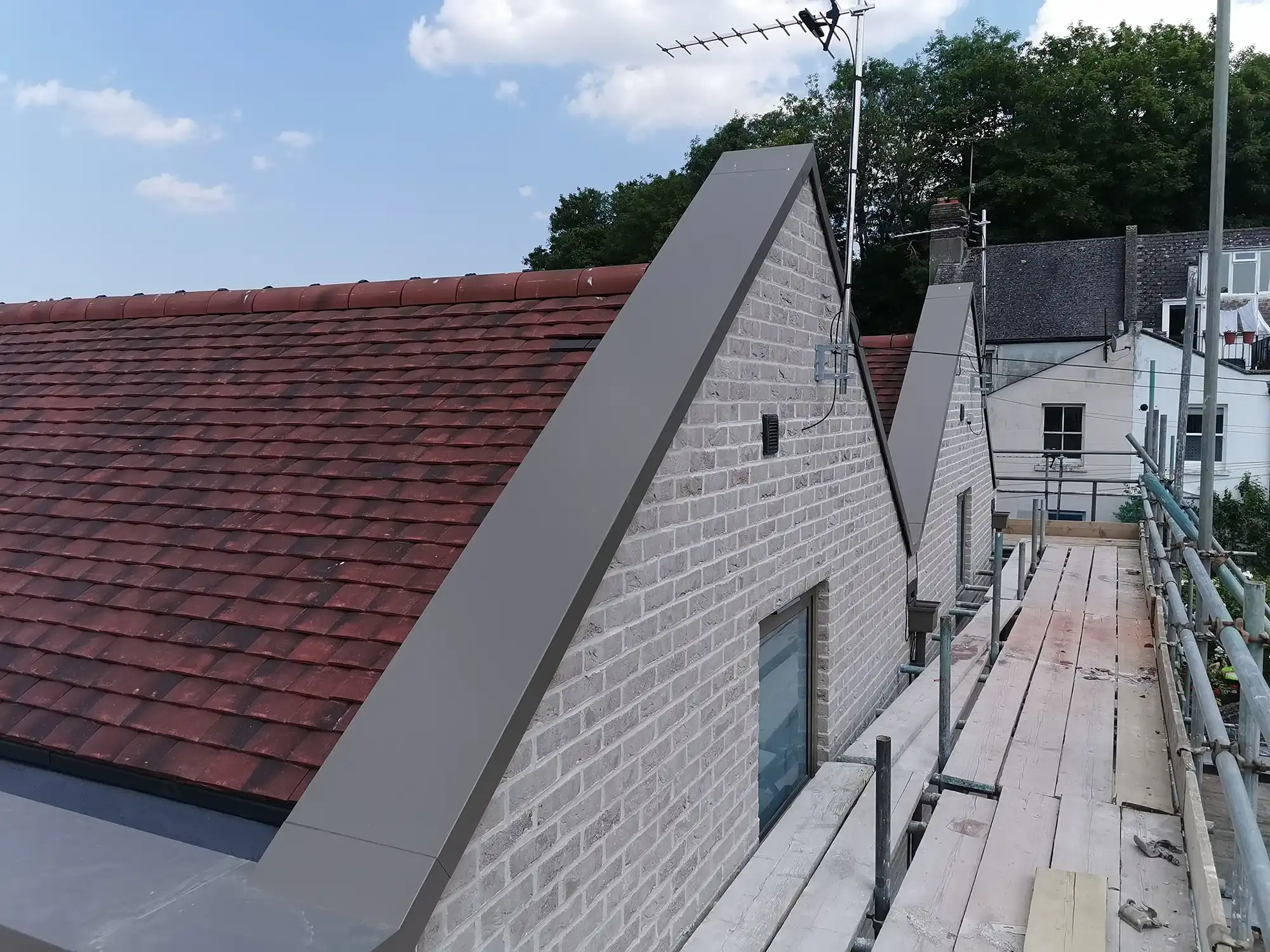 red roof with grey fascias