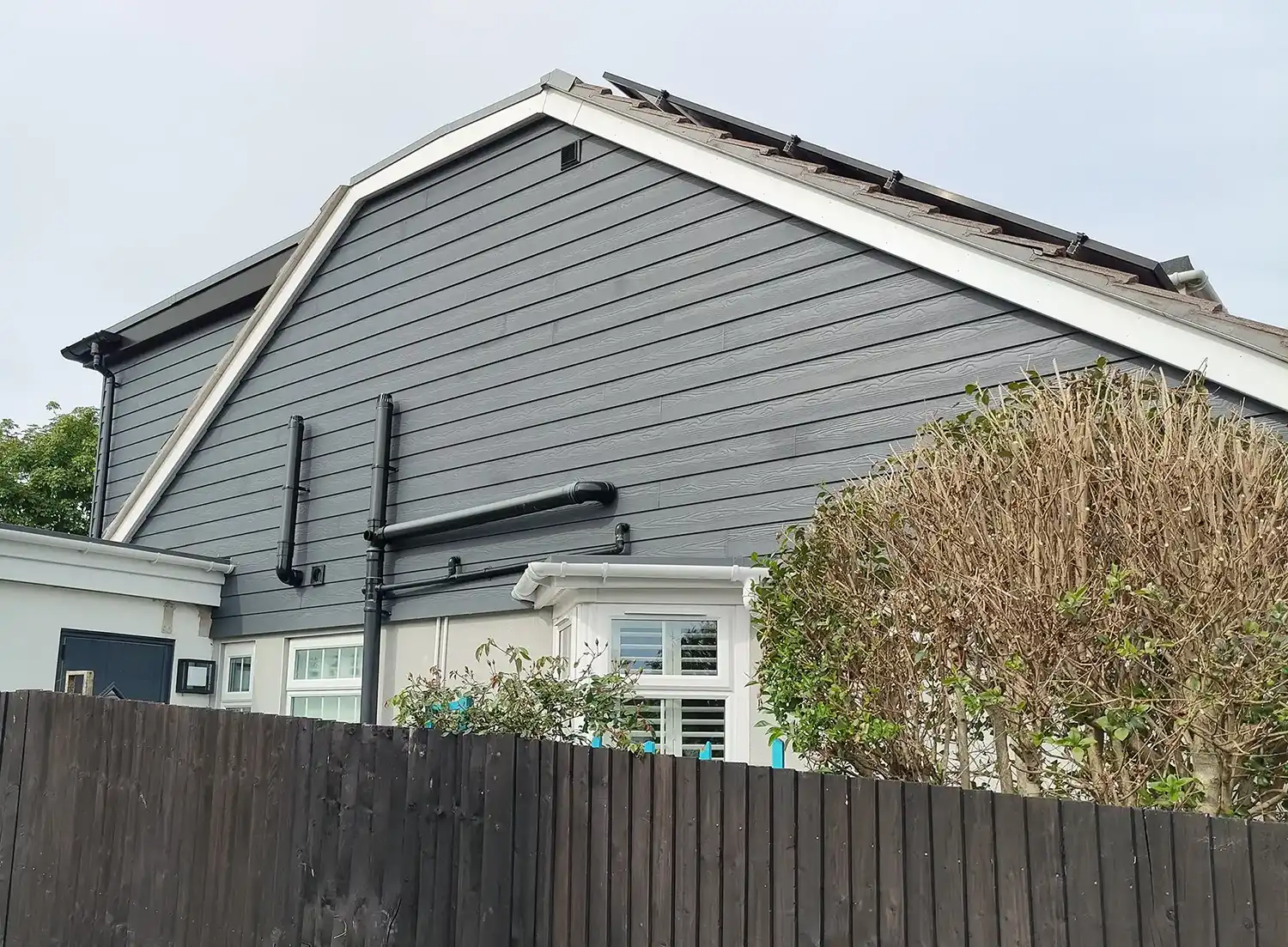 house with grey cladding