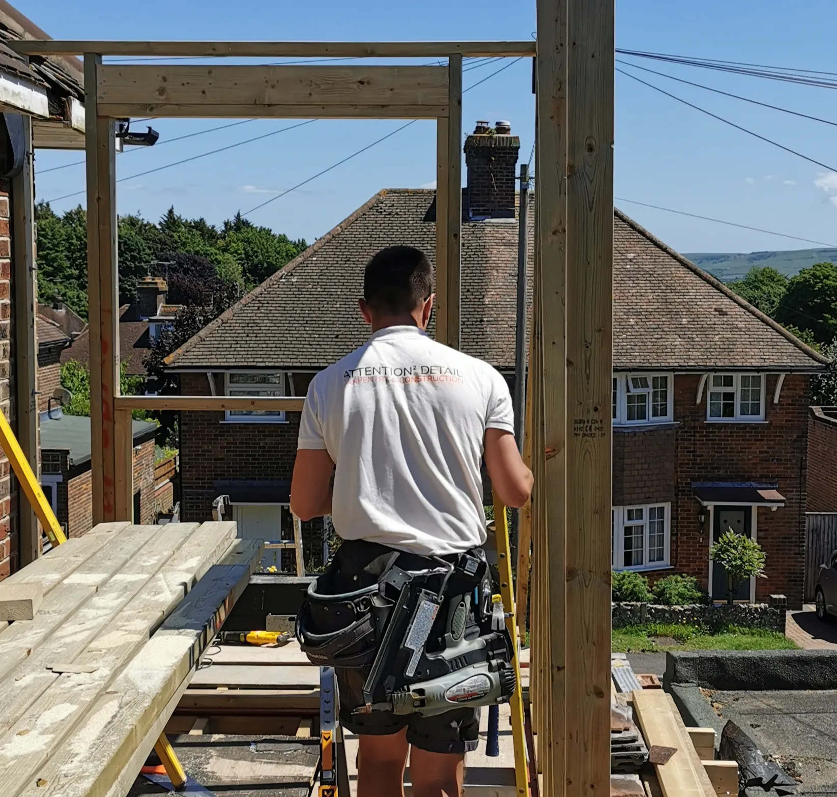 man on wooden scaffolding boards